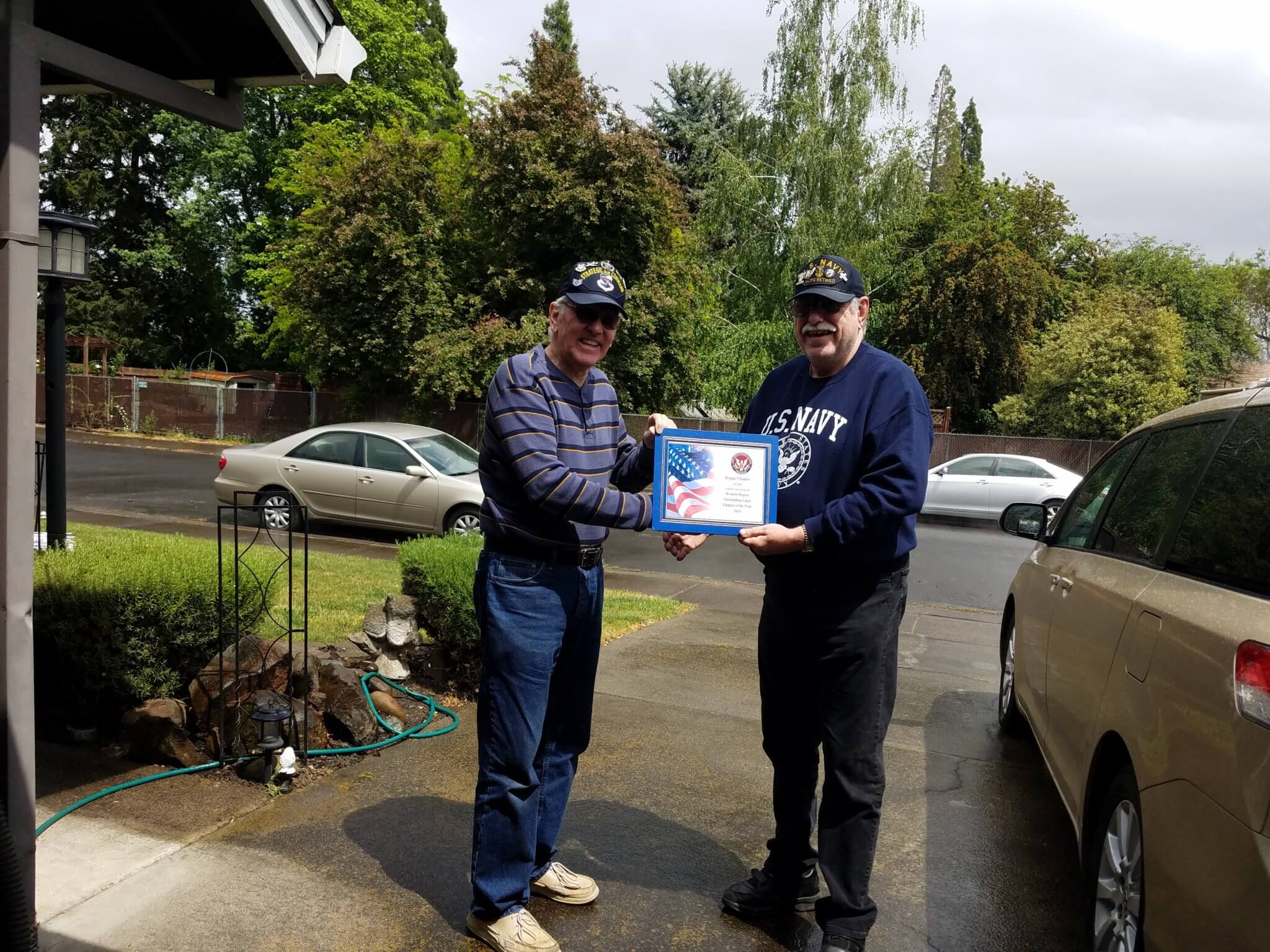 Chairman of the Board Terry M, Haines presenting the award for the 2019 Western Region Large Chapter of the Year award to Trustee & Treasurer Ron Kohl