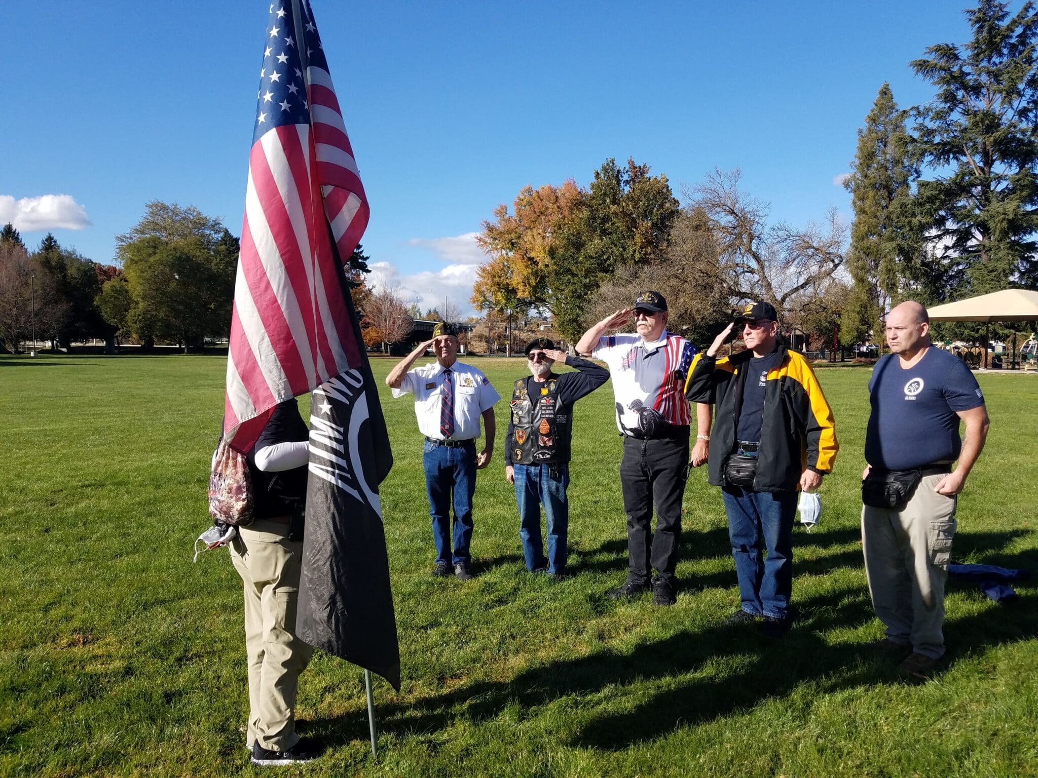 Ike Eisenhauer holds flag, Ken Wilson, Dick Schwegerl, Terry Haines, Ron Kohl & Eric Gomez