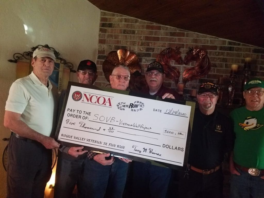 The picture is Chairman presenting the VeteRun proceeds to the SOVB Board for the Vietnam Wall Project.
