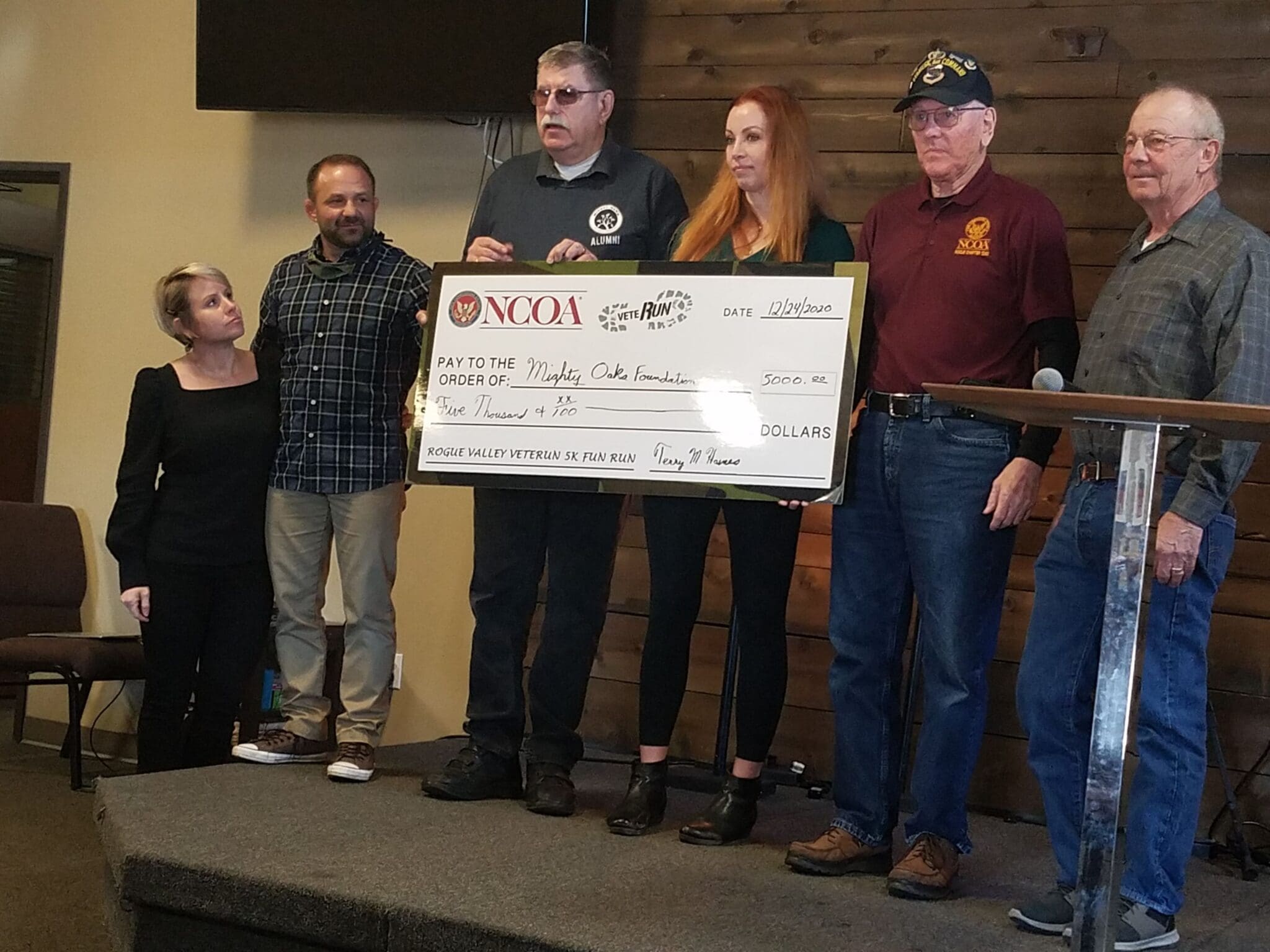 Terry Haines, Rachael Watters, Ron Kohl & Ken Wilson present Veterun check to Chad & Kathy Robichaux